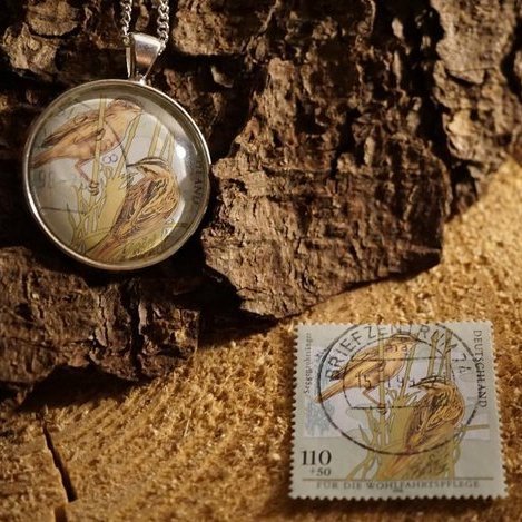 Amulett aus Briefmarke "Vögel"